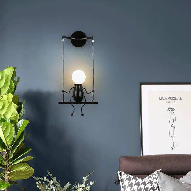 SwingLumi – LED wandlamp "Man op schommel"