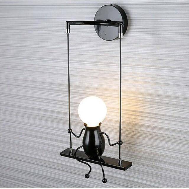 SwingLumi – LED wandlamp "Man op schommel"